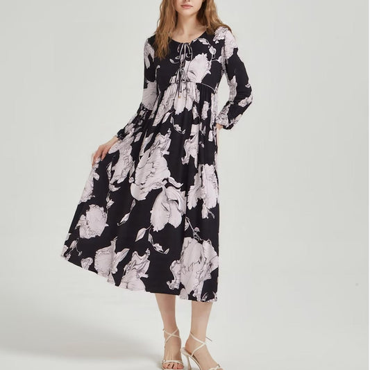 Malbusaat bohemian loose midi dress in black with large white floral print and long sleeves