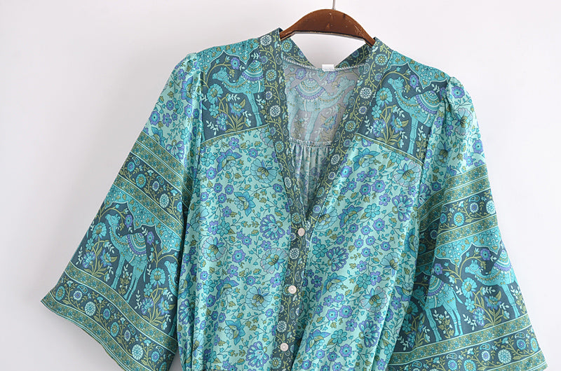 Malbusaat bohemian summer maxi dress in turquoise with floral and elephant print and button front