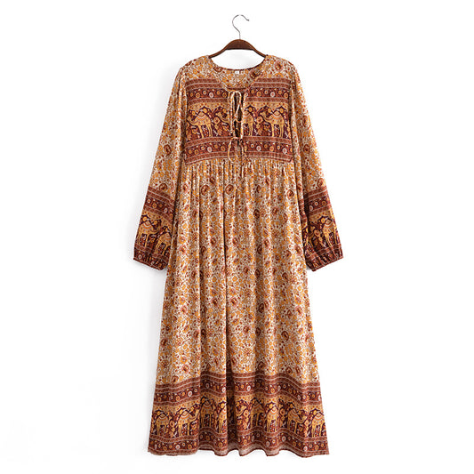 Boho floral dress online UK by Malbusaat with long sleeves and intricate earthy floral patterns