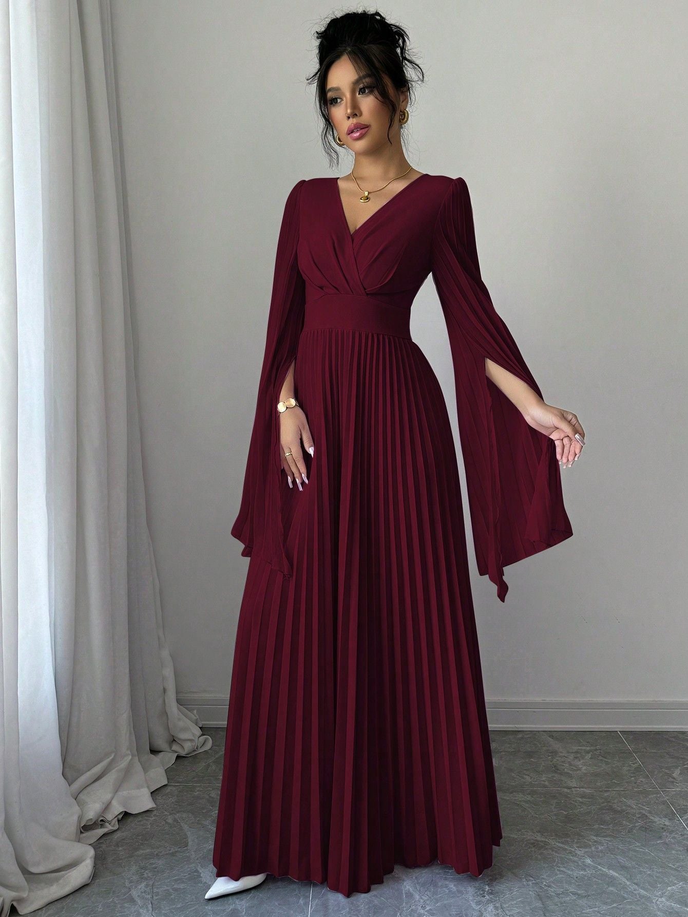Elegant burgundy Deep V pleated maxi dress with flowing sleeves for special occasions