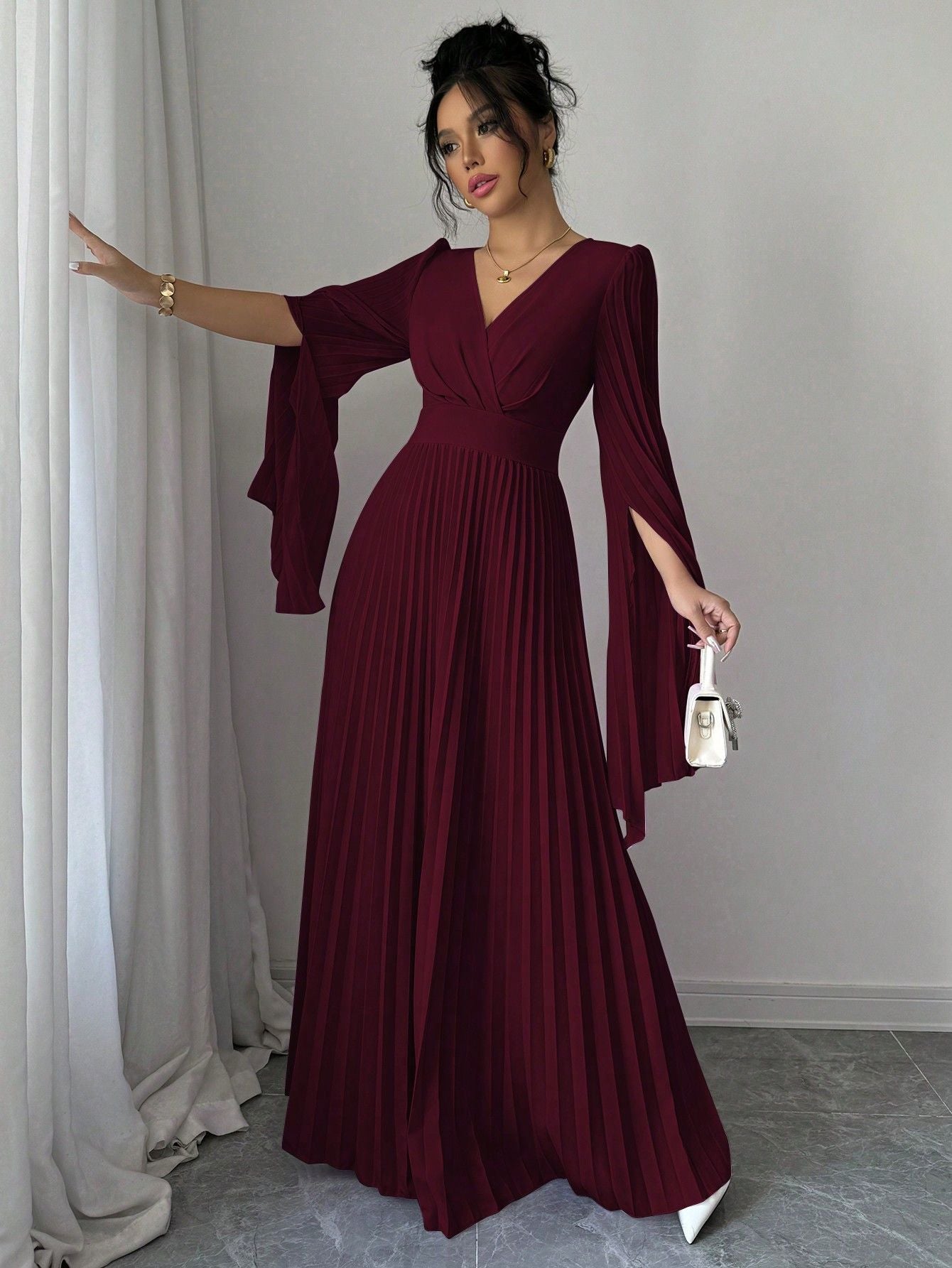 Elegant Malbusaat Deep V pleated maxi dress in burgundy with flowing sleeves for special occasions
