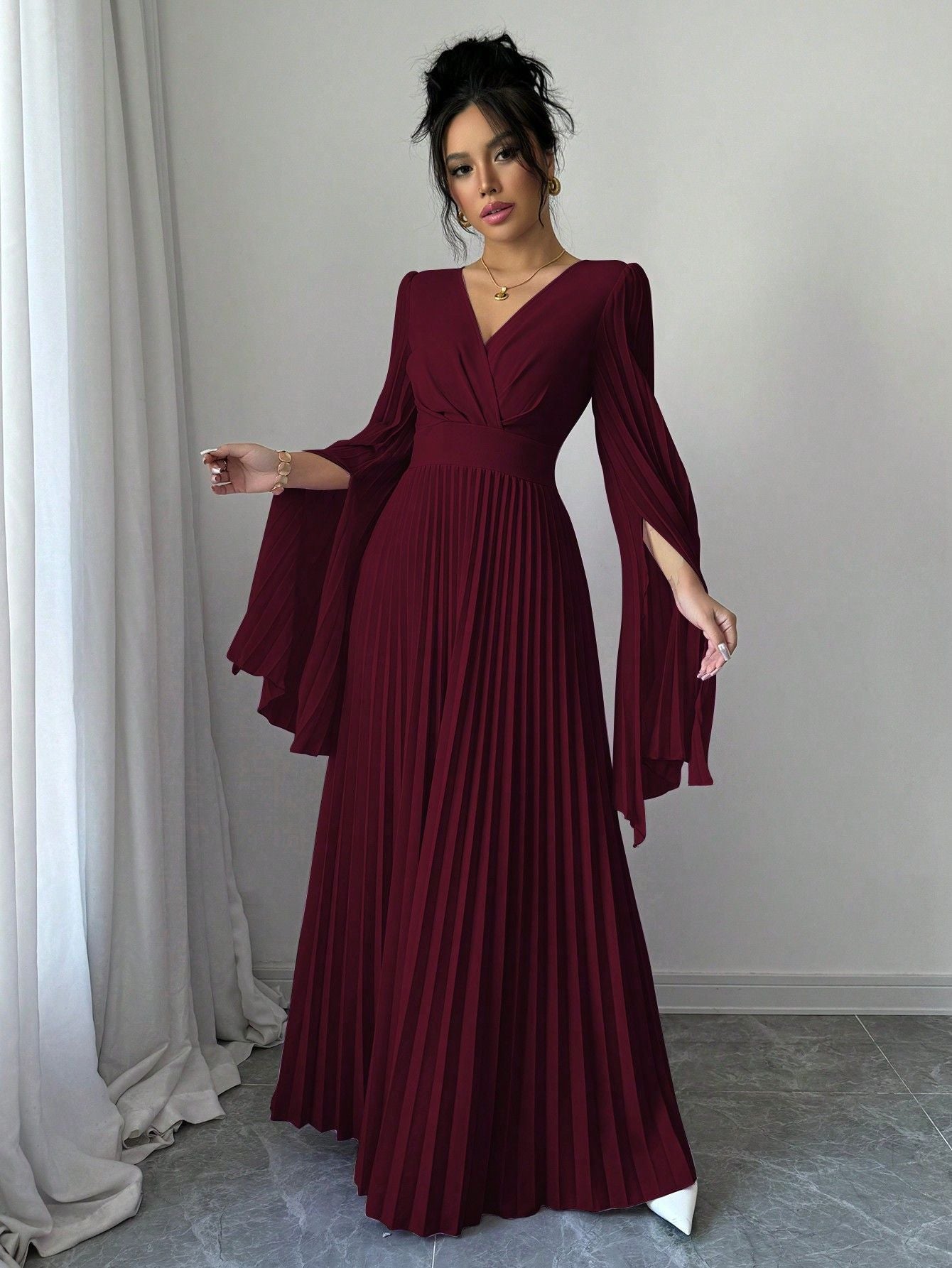 Elegant Malbusaat Deep V pleated maxi dress in burgundy with long sleeves and flattering silhouette