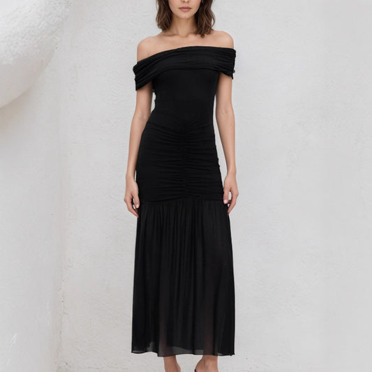 Elegant black off shoulder maxi dress by Malbusaat featuring ruched bodice and flowing skirt