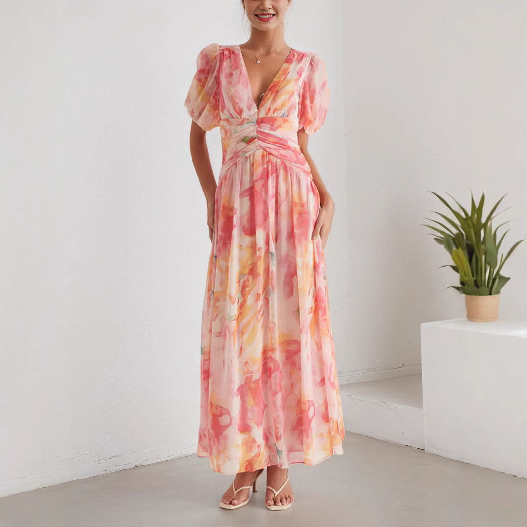 Stylish floral chiffon maxi dress from Venly with a flattering fit and elegant puff sleeves
