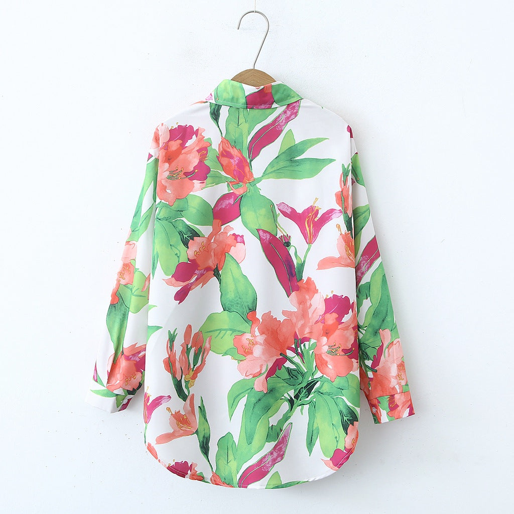 Back view of a vibrant Malbusaat floral print collared shirt with bright green and pink flowers