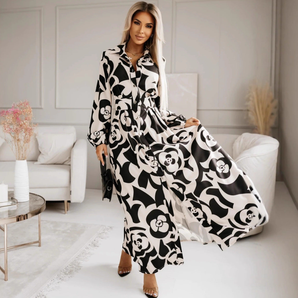 Elegant floral slit midi dress in black and white pattern, perfect for stylish occasions