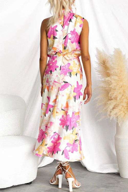 Back view of a Floral Strap Cutout Maxi Dress by Malbusaat with vibrant pink and yellow flowers