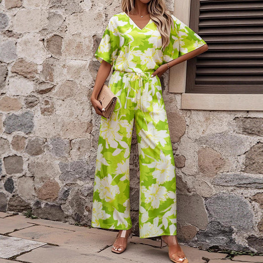 Malbusaat short sleeved ladies jumpsuit outfit with green and white floral print and wide leg trousers
