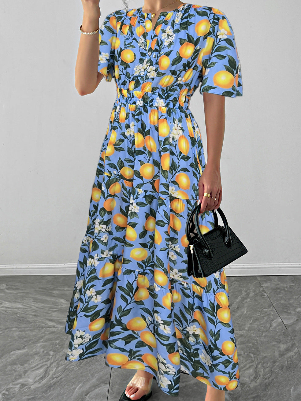 Malbusaat lemon print maxi dress with a floral design and a comfortable fit