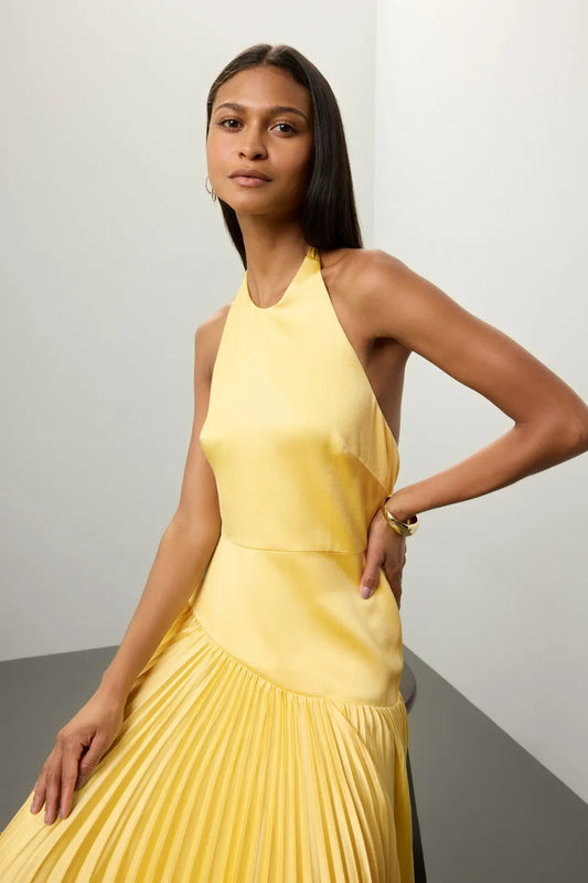 Malbusaat yellow Pleated Halter Dress for Summer with flowing skirt and sleeveless design