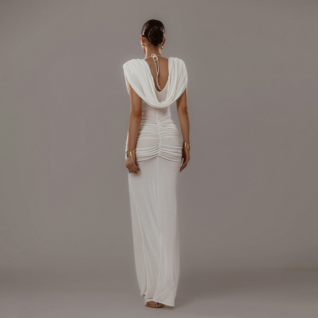 Elegant white pleated maxi dress UK with unique back design and flowing silhouette
