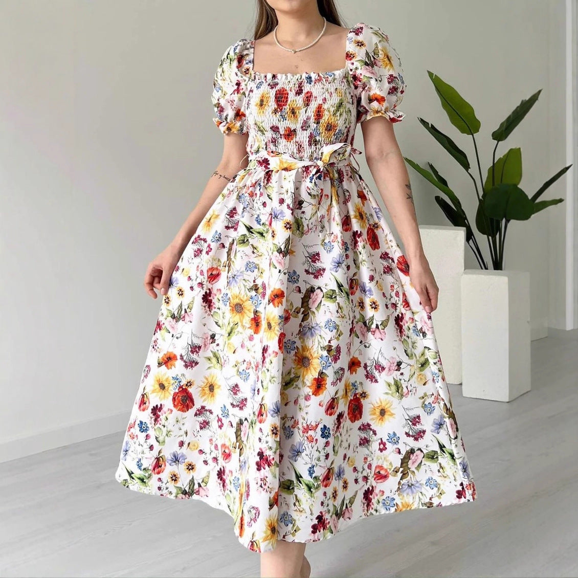 PLAYA puff sleeve floral midi dress with vibrant flowers on a white background, perfect for summer outings