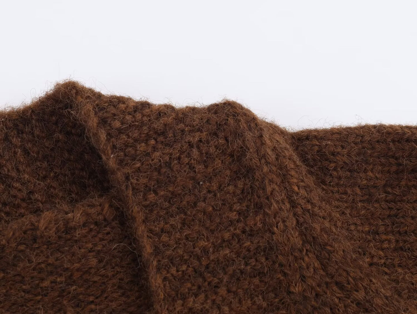 Close-up view of a brown retro v neck knit cardigan showcasing its textured fabric