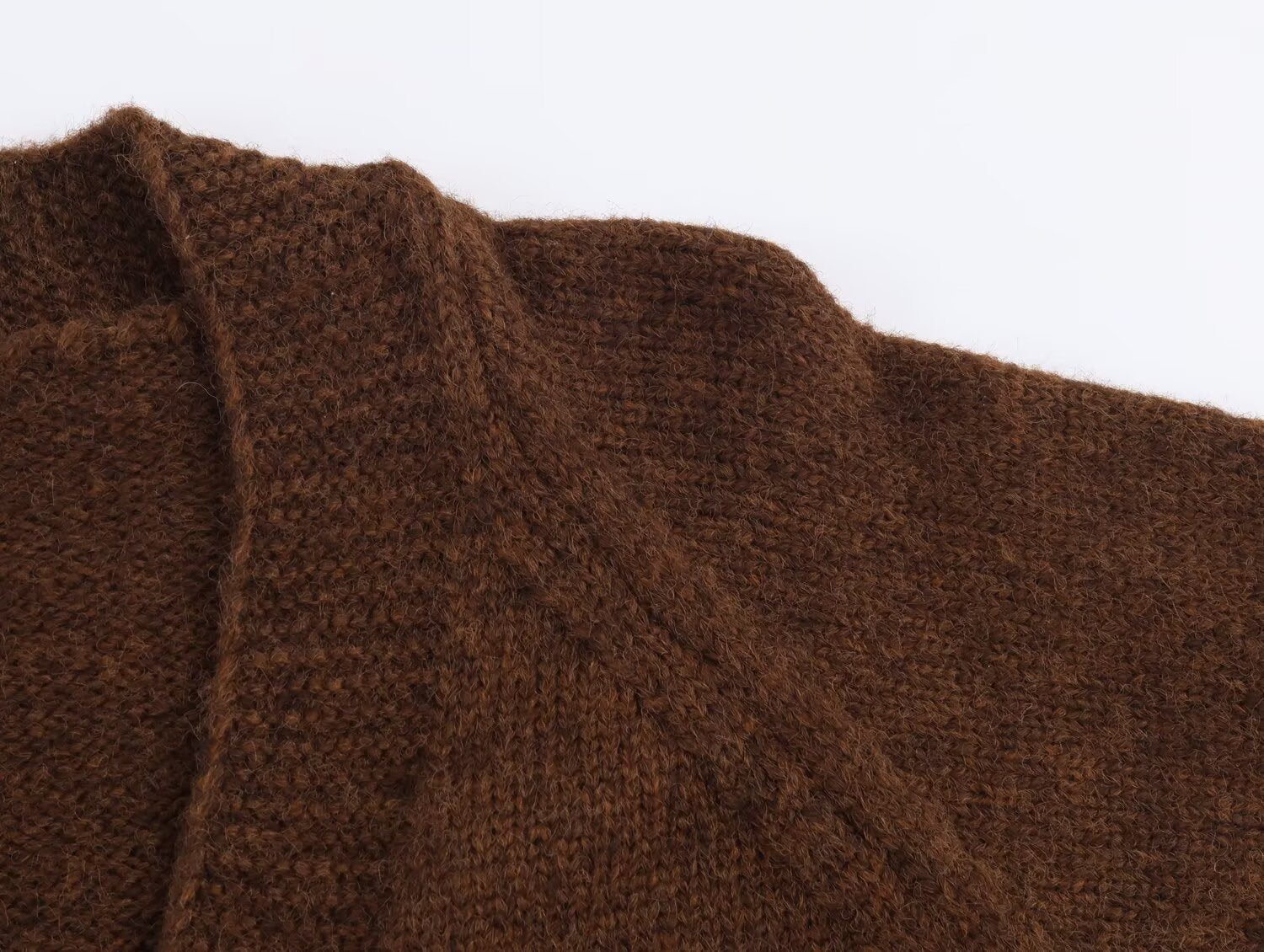 Close-up of a brown retro v neck knit cardigan with soft, textured fabric for comfortable wear
