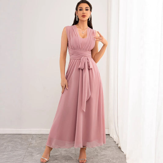 Malbusaat model wearing chiffon pink maxi dress UK sleeveless V neck ruched bodice waist tie floor length