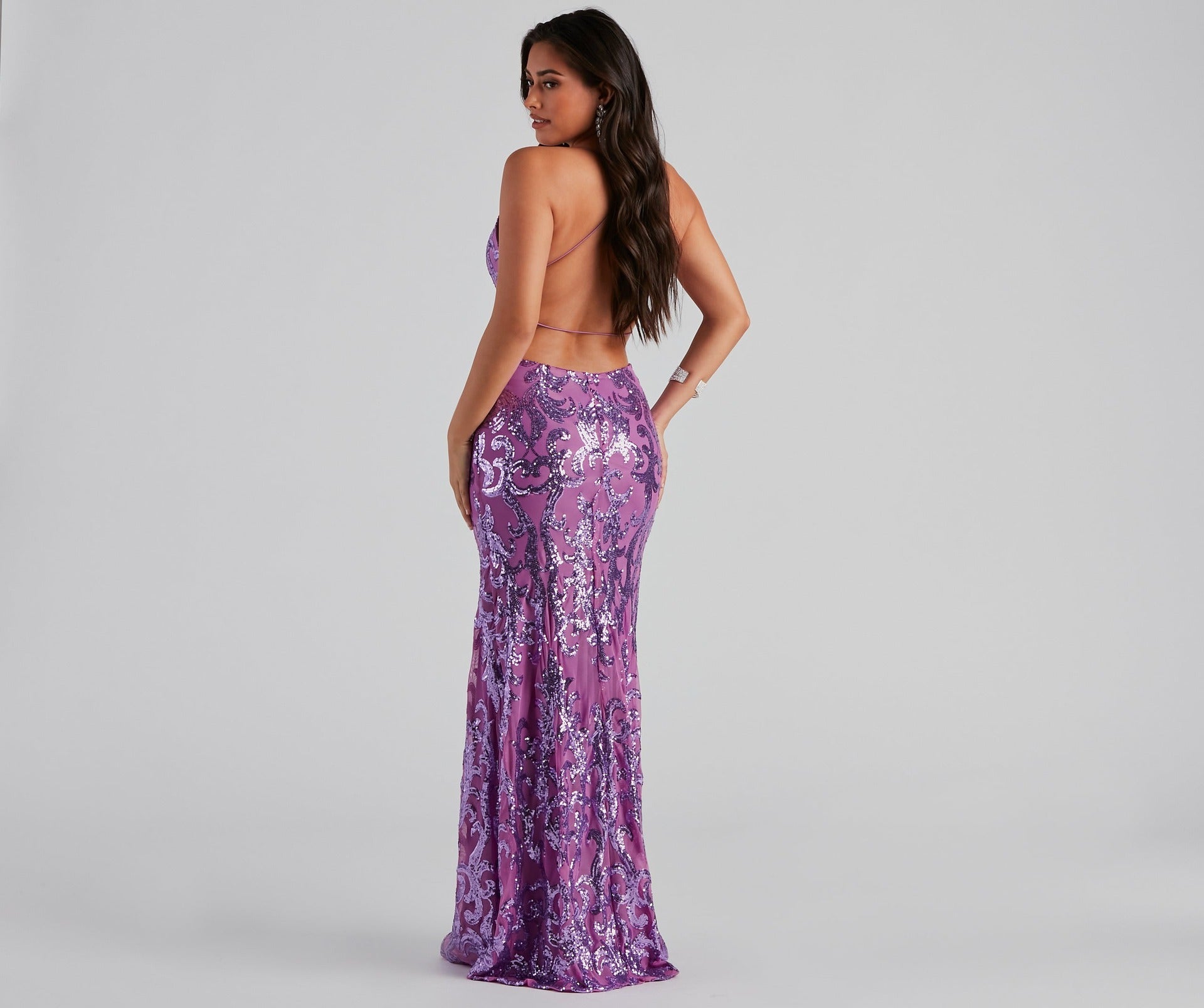 Back view of a stunning Malbusaat sequin party maxi dress in purple with a figure-hugging silhouette