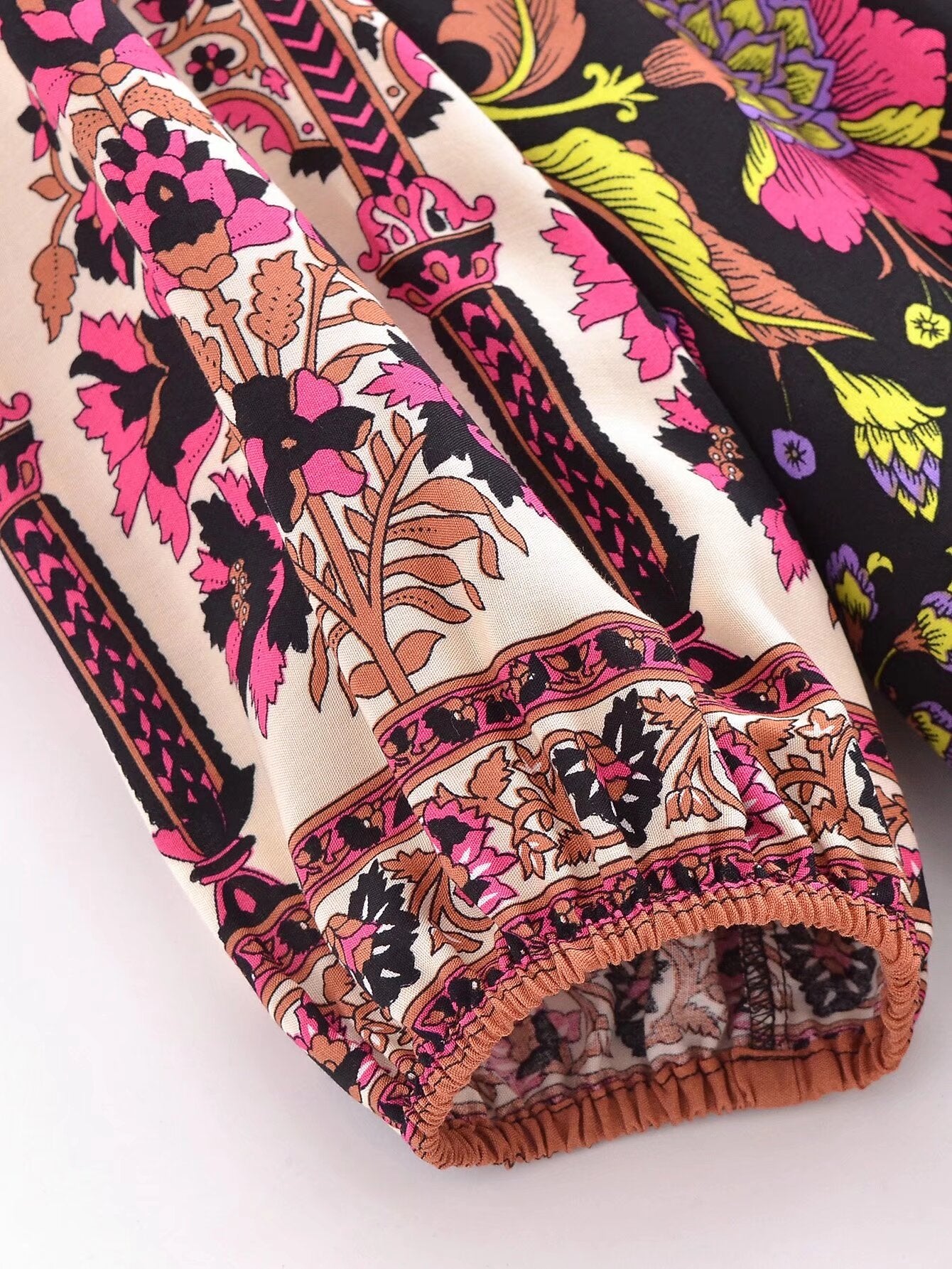 Close-up of sleeve detail showing vibrant pattern on a spring floral print maxi dress by Malbusaat
