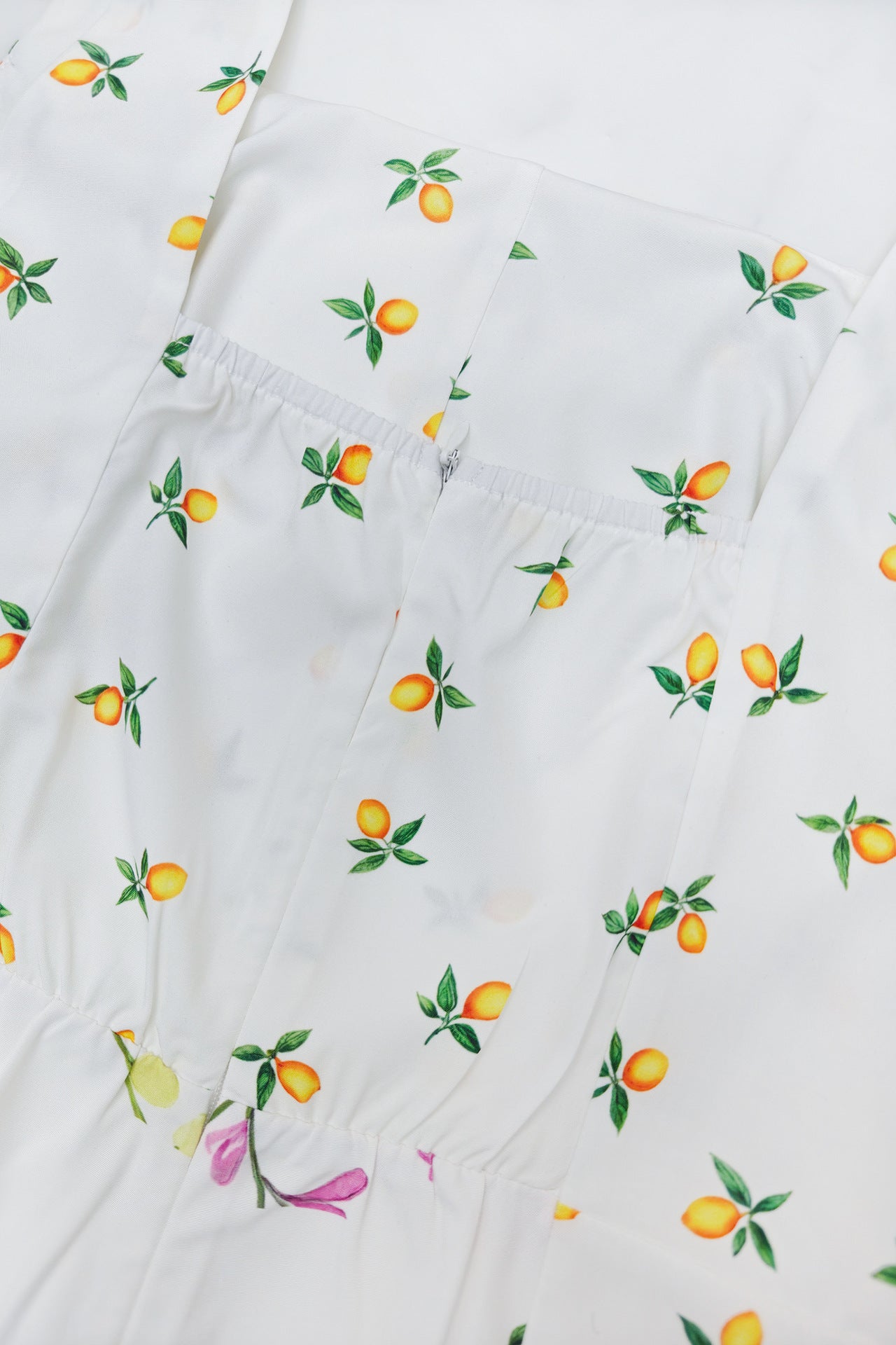 Close-up of the fabric featuring a floral print from a square neck holiday midi dress by Malbusaat
