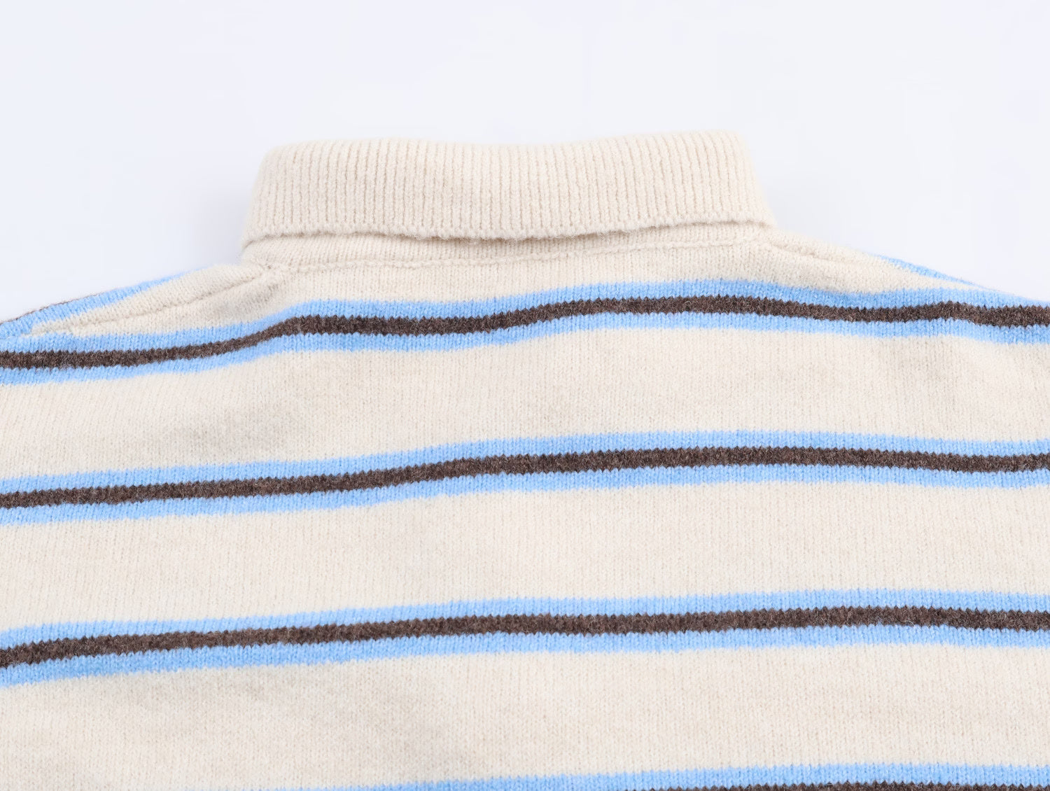 Back view of a Malbusaat striped polo knit pullover for women in beige with blue and brown stripes
