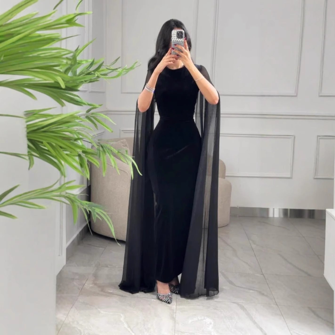 Elegant black velvet sheath maxi dress UK with sheer cape detail for a sophisticated look