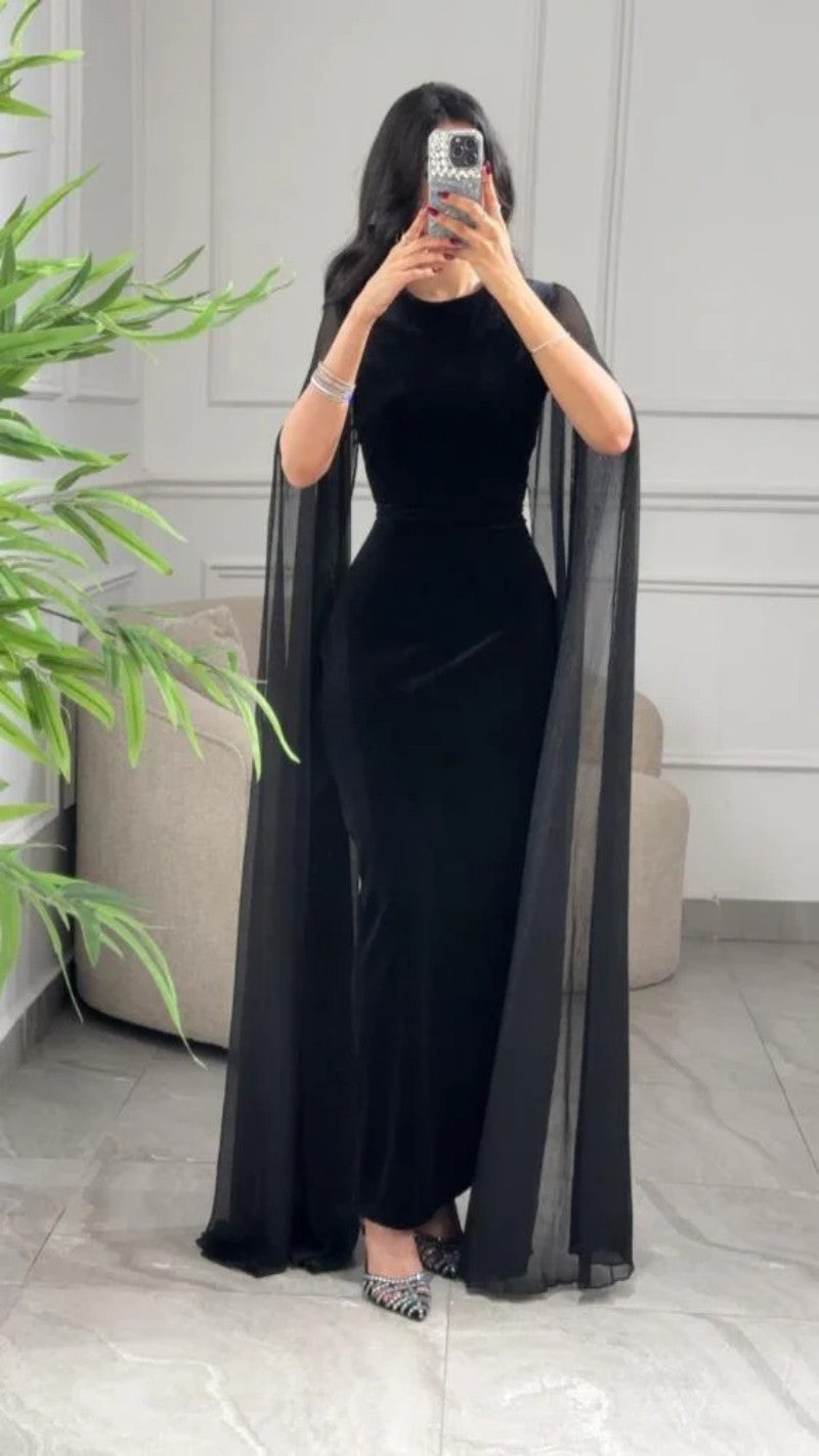 Elegant black velvet sheath maxi dress UK with flowing cape sleeves for formal occasions