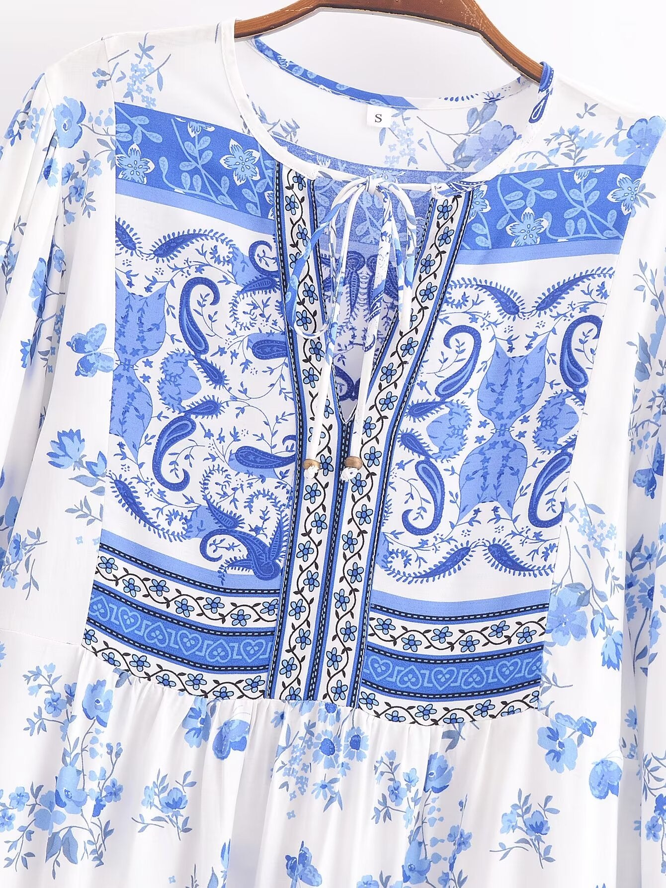 Malbusaat elegant puff sleeve spring midi dress with blue floral and intricate patterns on white fabric