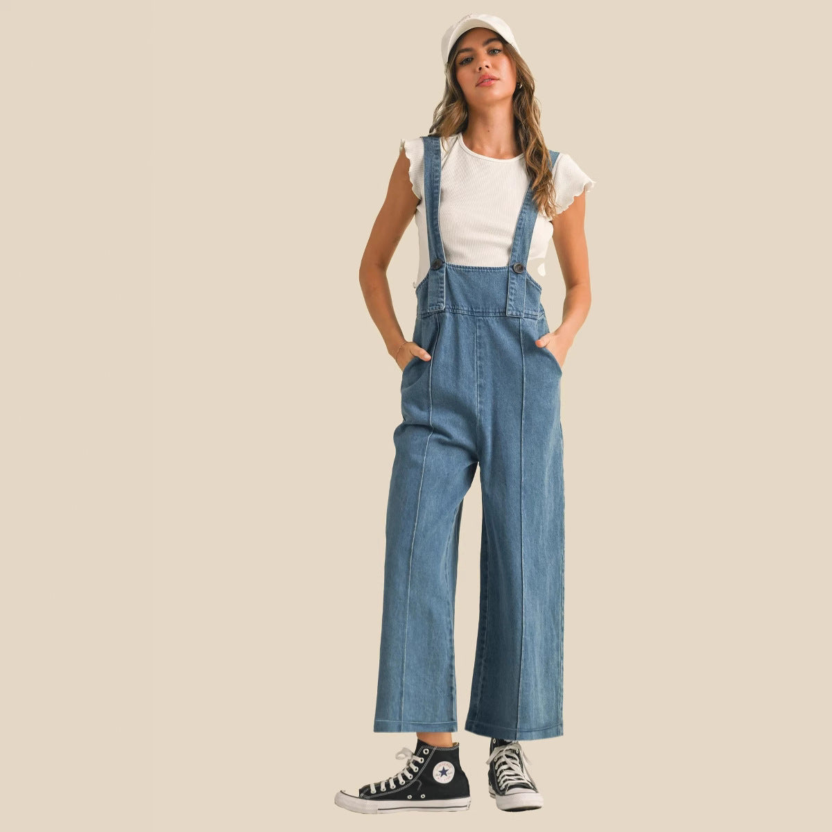 Stylish women's denim suspender pants with wide legs and side pockets for casual wear