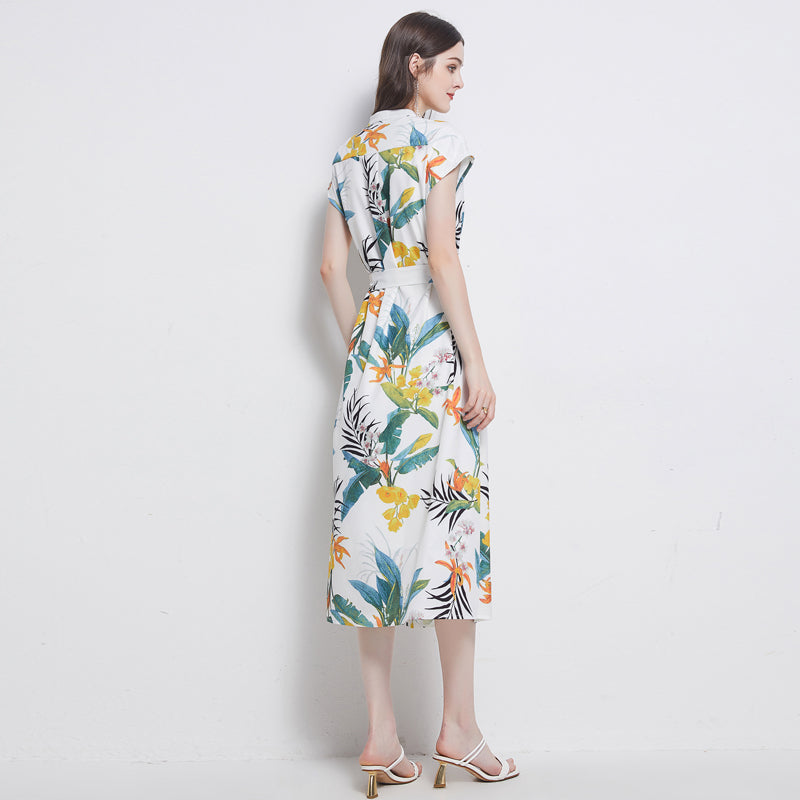 Back view of a woman wearing Malbusaat women's floral A line midi dress with short sleeves and colourful botanical print