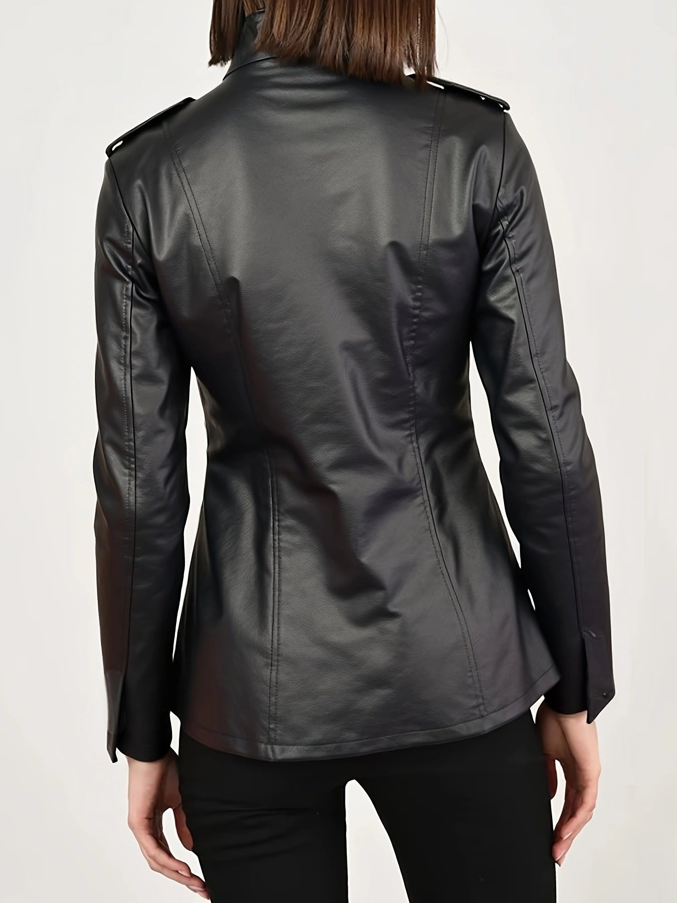 Back view of a women's gothic faux leather jacket with a tailored fit and stylish detailing