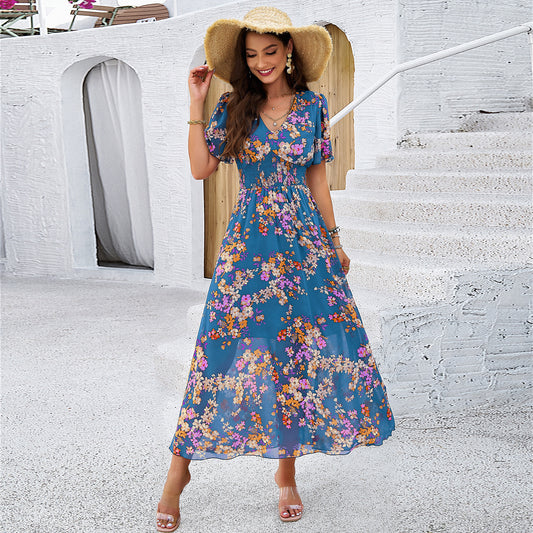 Floral Smocked Maxi Dress in - Dresses by Malbusaat